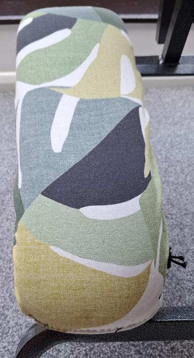 Cover fitted over a massage chair arm rest